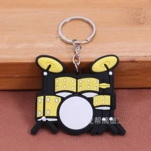 Брелок резиновый Ударная установка. Цвет желтый.